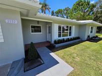 Charming single-story home with a well-manicured lawn and inviting front entrance at 2152 Mckinley St, Clearwater, FL 33765