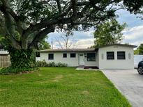 Charming single story home with a large shade tree on the front lawn and ample space for parking at 7026 20Th N St, St Petersburg, FL 33702