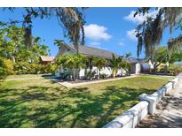 Charming home with well-manicured lawn and decorative plants, creating an inviting curb appeal at 705 28Th N St, St Petersburg, FL 33713