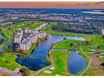 Aerial view of community near golf course and water at 1200 Country Club Dr # 6103, Largo, FL 33771