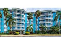 Blue building exterior, palm trees, and parking lot at 3315 58Th S Ave # 218, St Petersburg, FL 33712