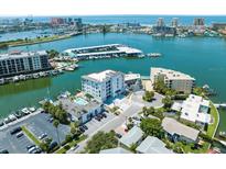 Aerial view of waterfront community with boat slips at 211 Dolphin Pt # 201, Clearwater, FL 33767
