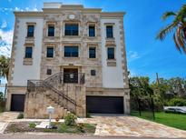 Luxury home with stone facade and two-car garage at 3087 Cherry Ln, Clearwater, FL 33759