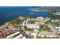 Aerial view of community with pool, tennis court, and lush landscaping at 2700 Bayshore Blvd # 5109, Dunedin, FL 34698