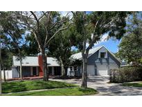 Charming two-story home with a two-car garage and landscaped yard at 7430 18Th Ne St, St Petersburg, FL 33702
