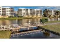 View of community with bridge and water features at 1200 Country Club Dr # 5402, Largo, FL 33771