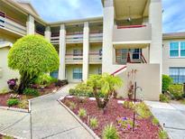 Two-story building with landscaping and walkway at 4529 Whitton Way # 223, New Port Richey, FL 34653