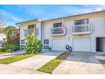 Two-unit townhouse with attached garages and private balconies at 6264 92Nd Pl N # 3104, Pinellas Park, FL 33782
