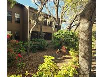 Charming condo nestled among mature trees and lush landscaping at 103 Cypress Pond Rd # 103, Palm Harbor, FL 34683
