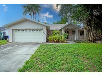 Single-Gathering home with attached garage and front porch at 1901 Ohio Ne Ave, St Petersburg, FL 33703