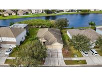 Aerial view of single-Gathering home and canal at 2622 Yukon Cliff Dr, Ruskin, FL 33570