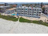 Aerial view of beachfront condo building at 3200 Gulf Blvd # 311, Belleair Beach, FL 33786