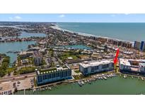 Aerial view of waterfront property near the beach at 300 150Th Ave # 411, Madeira Beach, FL 33708