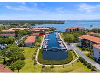 Aerial view of waterfront property with boat slips and canal access at 1801 Mariner Dr # 20, Tarpon Springs, FL 34689