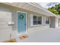 House exterior with light blue door and landscaping at 3505 75Th N St, St Petersburg, FL 33710