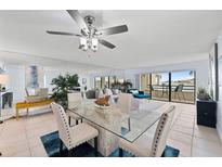 Bright dining area with glass-top table, seating for four and water views at 138 1St E St # 106, Tierra Verde, FL 33715