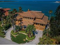 Luxury waterfront home with expansive driveway and ocean views at 806 Columbus Dr, Tierra Verde, FL 33715