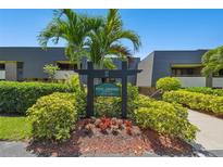 Royal Aberdeen Lodge building sign with landscaping at 36750 Us Highway 19 N # 22208, Palm Harbor, FL 34684