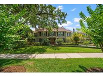 Two-story house with a large front yard at 327 Lotus Path, Clearwater, FL 33756