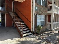 Exterior view of a concrete staircase leading to building entrance at 10200 Gandy N Blvd # 816, St Petersburg, FL 33702