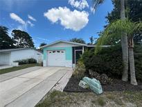 Charming single story home with attached garage and landscaping at 5060 86Th Ave N, Pinellas Park, FL 33782