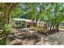 Charming house with lush landscaping and patio at 1006 E Fern St, Tampa, FL 33604
