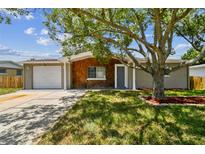 Charming single story home with a well manicured lawn at 3353 Columbus Dr, Holiday, FL 34691