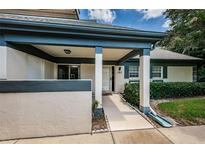 Well-maintained exterior with covered entryway and landscaping at 1377 N Mcmullen Booth Rd # 1377, Clearwater, FL 33759