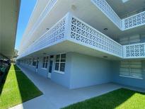 Building exterior with light blue paint and unique balconies at 4720 Locust Ne St # 114, St Petersburg, FL 33703