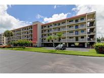Two-story condo building with parking and landscaping at 9490 Harbor Greens Way # 205, Seminole, FL 33776