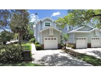 Two-story house with attached garage and attractive curb appeal at 577 Vista Trail Ct, Palm Harbor, FL 34683
