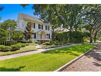 Charming two-story home with white siding and well-manicured lawn at 716 14Th Ne Ave, St Petersburg, FL 33701