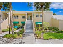 Well-maintained condo building with lush landscaping and private entrance at 10823 Indian Hills Ct # 33, Seminole, FL 33777