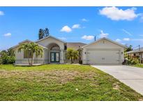 Single Gathering home with two car garage and landscaping at 7162 Benson St, Englewood, FL 34224