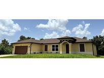 Attractive single-story home with a brown roof and a well-maintained lawn at 1495 Robwood Ter, North Port, FL 34288
