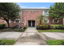 Brick building exterior with a walkway leading to the entrance at 3455 41St S Ter # 208, St Petersburg, FL 33711