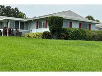 Ranch style home with lush green lawn at 1604 Whitebridge Dr # A, Palm Harbor, FL 34684