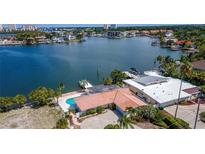 Aerial view of waterfront home with private pool and dock at 1884 Dolphin S Blvd, St Petersburg, FL 33707