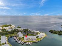 Stunning aerial view of waterfront condos with boat docks and serene water views and boat parking at 5257 Beach Se Dr # D, St Petersburg, FL 33705
