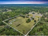 Aerial view of a large property with cultivated land at 3011 Endsley Rd, Brooksville, FL 34604