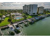 Waterfront condo complex featuring a marina, pool, tennis courts, and stunning views at 660 Island Way # 301, Clearwater Beach, FL 33767