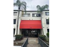 Condo building with inviting red awning at 2587 Countryside Blvd # 6306, Clearwater, FL 33761