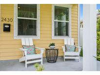 Front porch with two white chairs and small table at 2430 6Th N Ave, St Petersburg, FL 33713