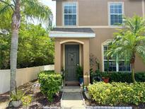 Charming home entrance with a beautifully landscaped front yard and a cozy, inviting doorway at 6546 Marlberry Way, Largo, FL 33773