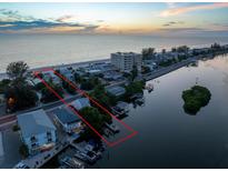 Beachfront property with canal access and sunset views at 20051 Gulf Blvd, Indian Shores, FL 33785