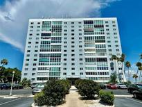 High rise building exterior with ample parking at 7200 Sunshine Skyway S Ln # 7E, St Petersburg, FL 33711