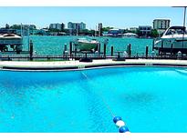 Inviting community pool with waterfront views at 660 Island Way # 401, Clearwater, FL 33767