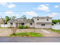 Two story home with a spacious yard at 651 Jungle Queen Way, Longboat Key, FL 34228