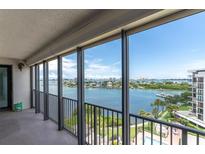 Enjoy the picturesque water view from this condo balcony with black metal railings and neutral flooring at 6 Belleview Blvd # 706, Belleair, FL 33756
