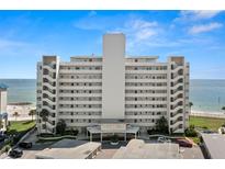 Stunning waterfront condominium building featuring private balconies and breathtaking ocean views on a clear day at 7000 Beach Plz # 505, St Pete Beach, FL 33706